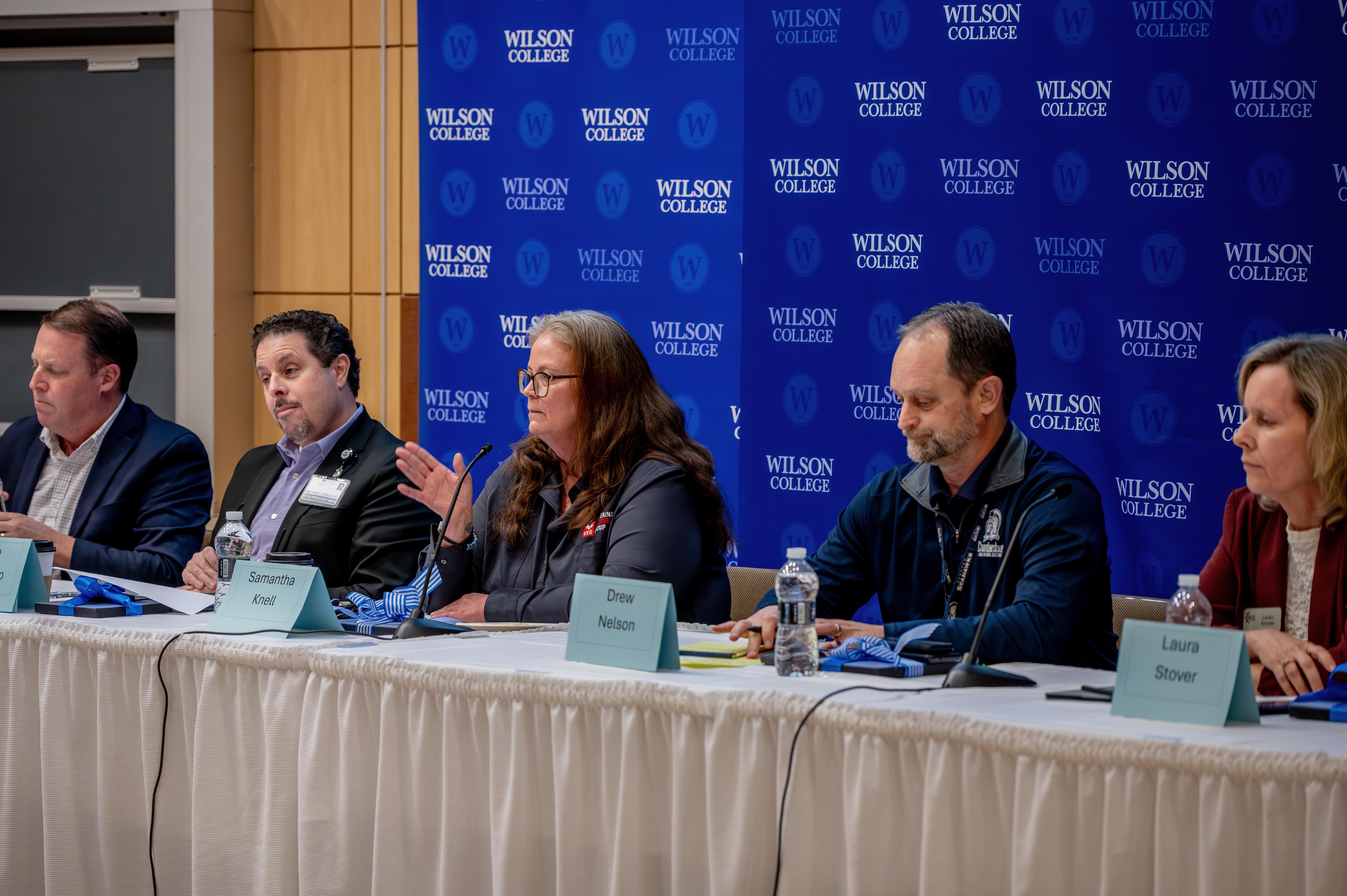 panelists in business leadership seminar