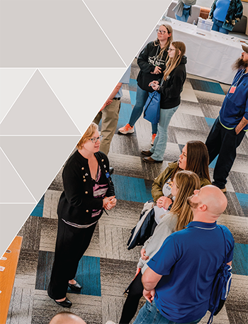 crowd looking at research posters